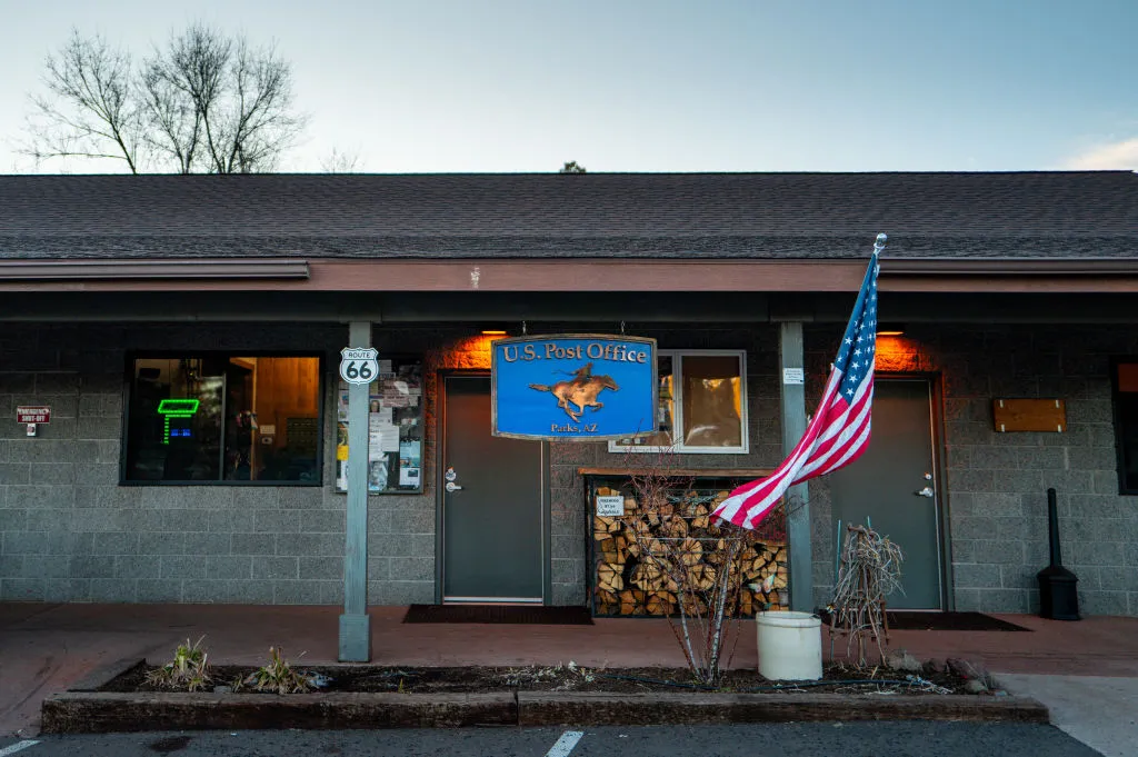 A building with a "U.S. Post Office" sign is pictured.