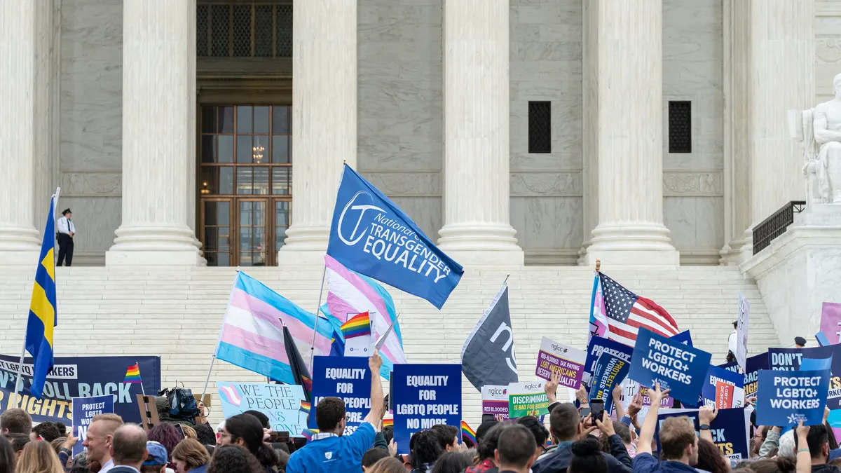 Individuals gather outside the U.S. Supreme Court.
