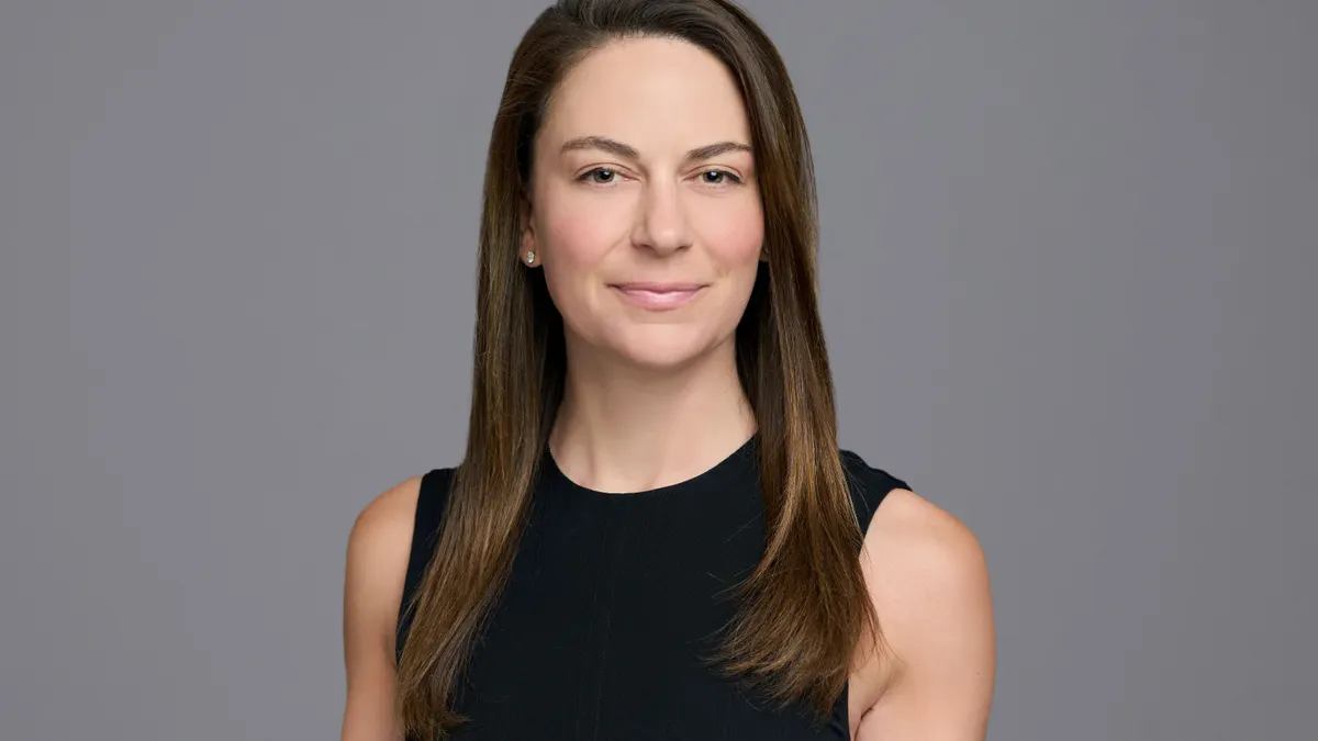A professional headshot of Katie Tolson.