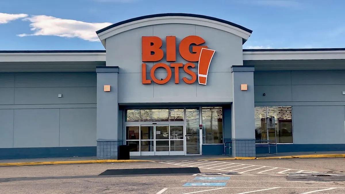 A store with a sign in orange letters that says "Big Lots!"