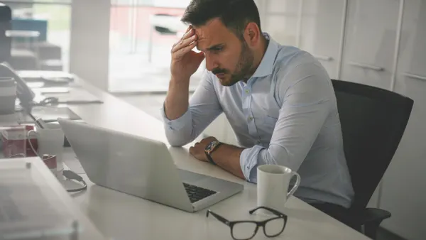 Business man having problem at work.