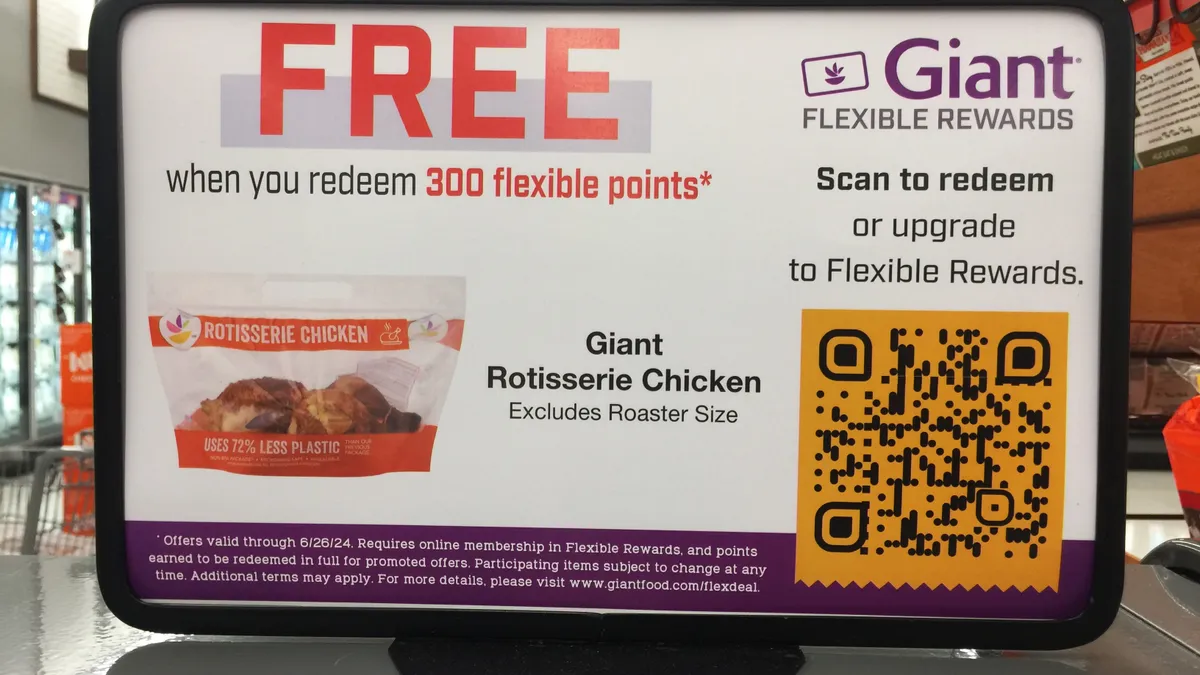 Sign about free rotisserie chicken in a supermarket