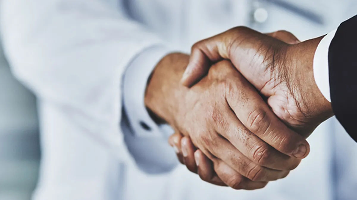 Close up of two hands shaking