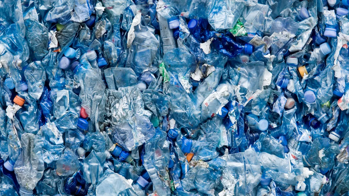 blue plastic bottles crushed together