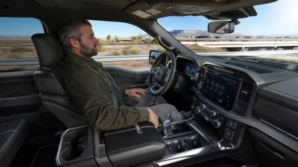 A driver using Ford's BlueCruise hands-free highway driving feature in a F-150 Platinum pickup.