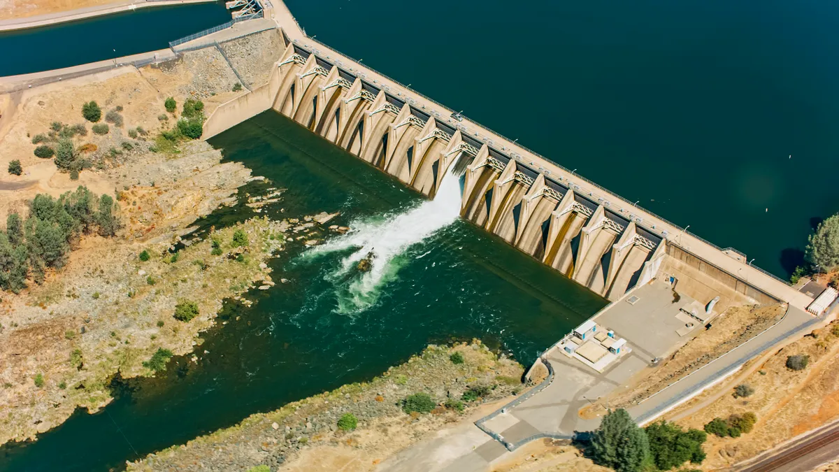 Water flows through a spillway at a hydroelectric dam.