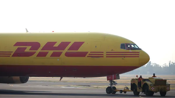 A DHL airplane is pulled at Benito Juarez International Airport on December 23, 2020 in Mexico City, Mexico.