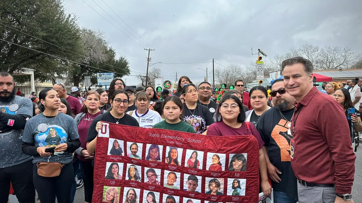 Sen. Roland Gutierrez marches with families of Uvalde victims on Martin Luther King Day.