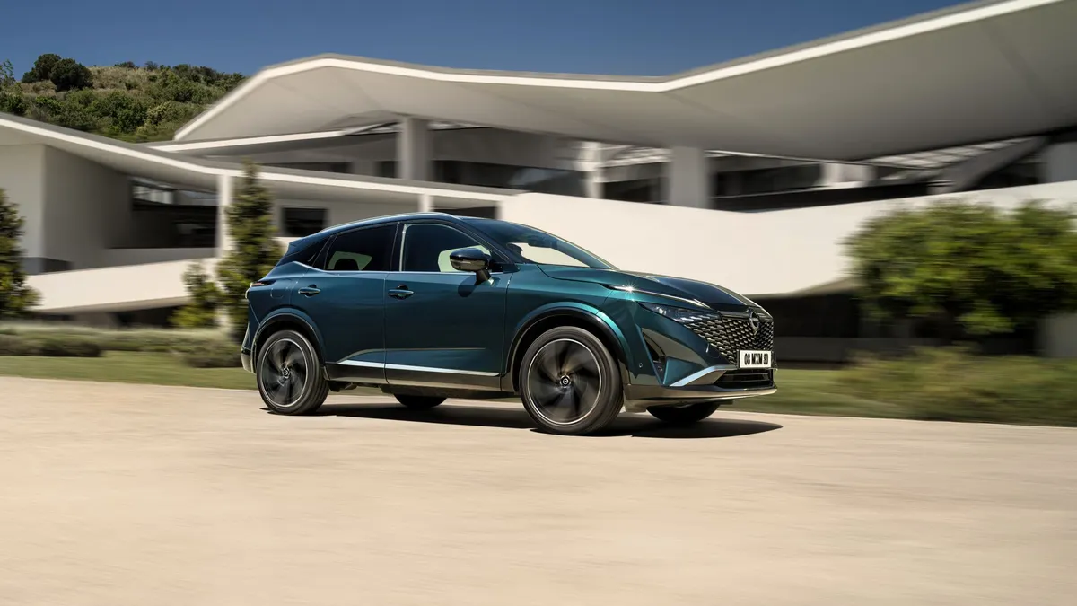 A Nissan Qashqai e-Power hybrid drives along.