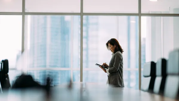 An executive in a business meeting room