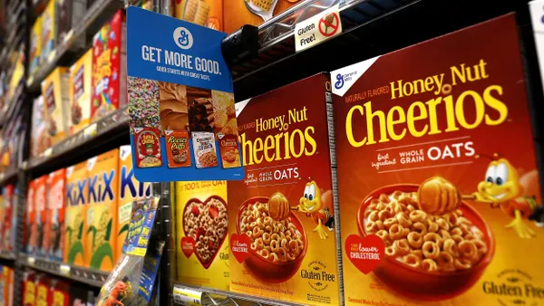 A store shelf with Honey Nut Cheerios.