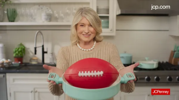 Martha Stewart holds a football in a baking dish in a JCPenney ad