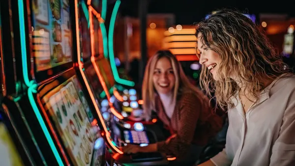 Friends playing on slot machines