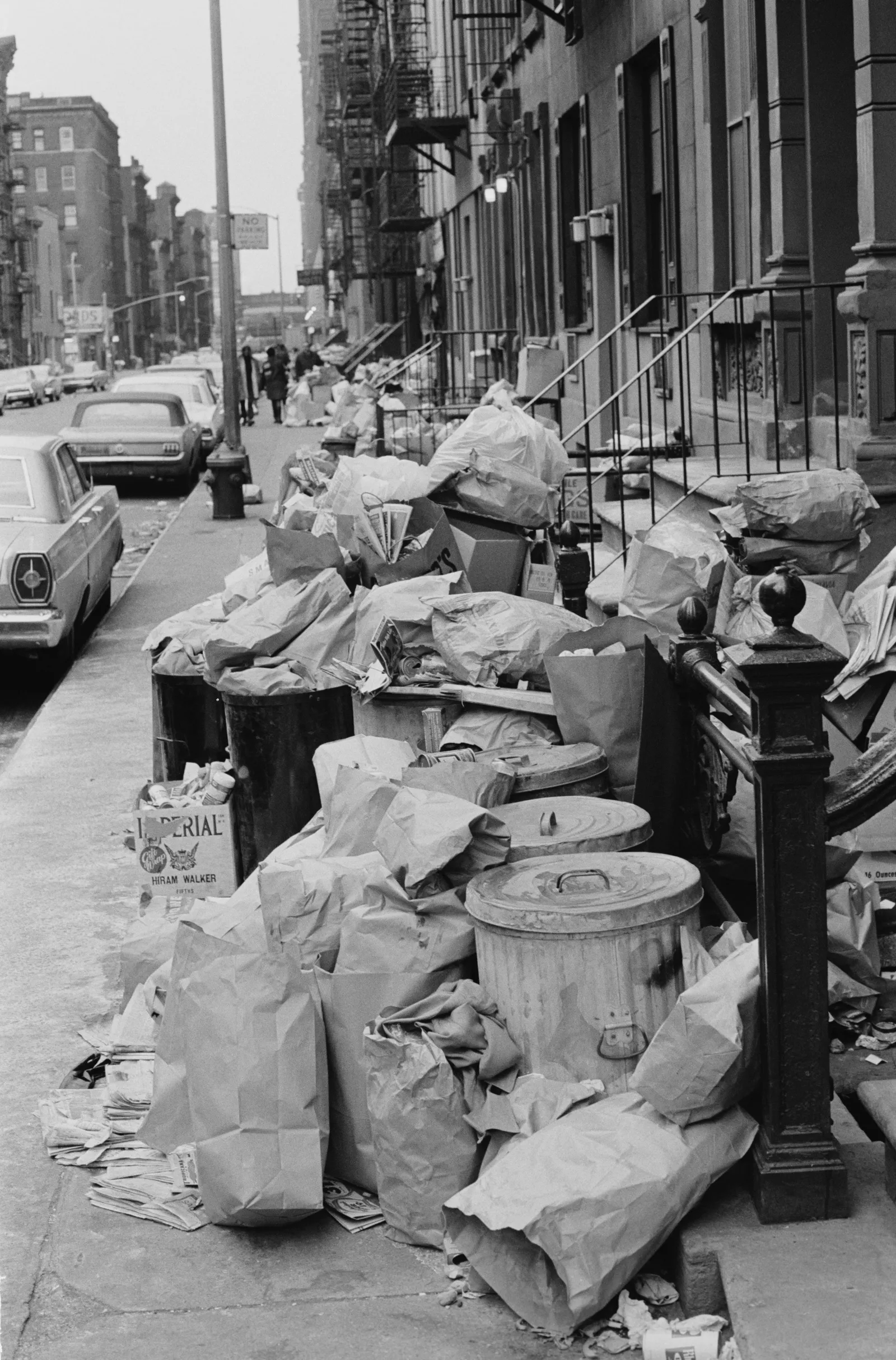 Piles of garbage overflowing from metal cans on the streets of New York during a strike