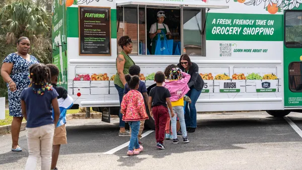 Children approaching Sprouts Mobile Truck