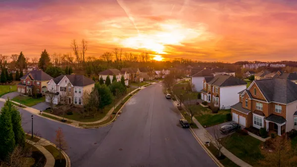 Aerial view of a suburb during sunset