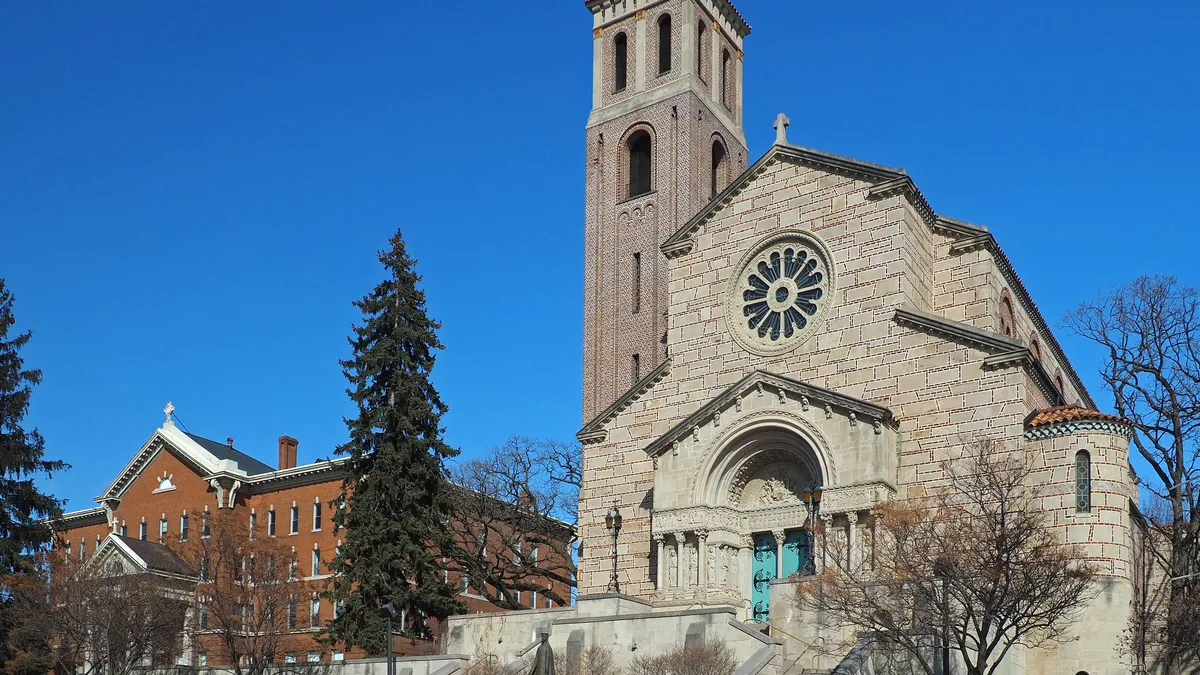 Looking up at Derham Hall and Our Lady of Victory Chapel.