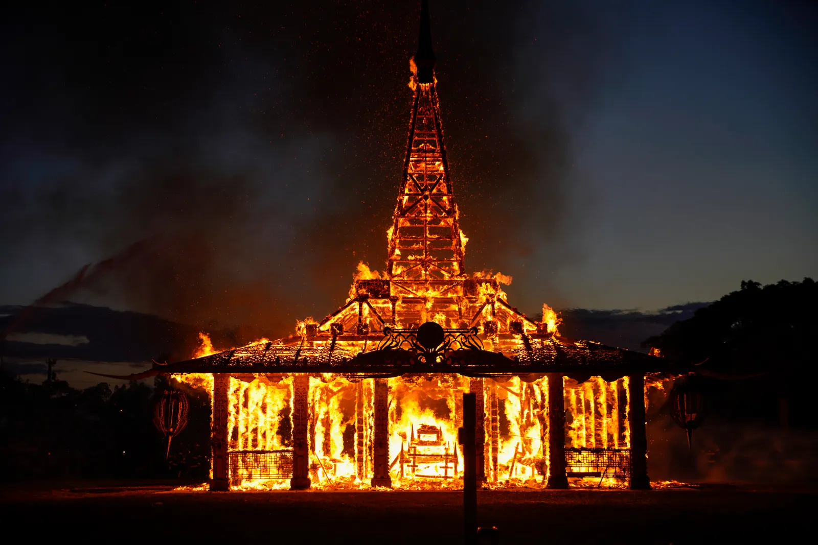 A structure on fire at night