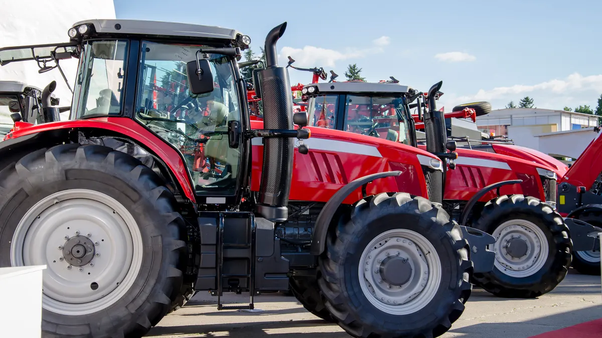 Red large tractor, machine for sowing, preparation and cultivation of soil for farmers