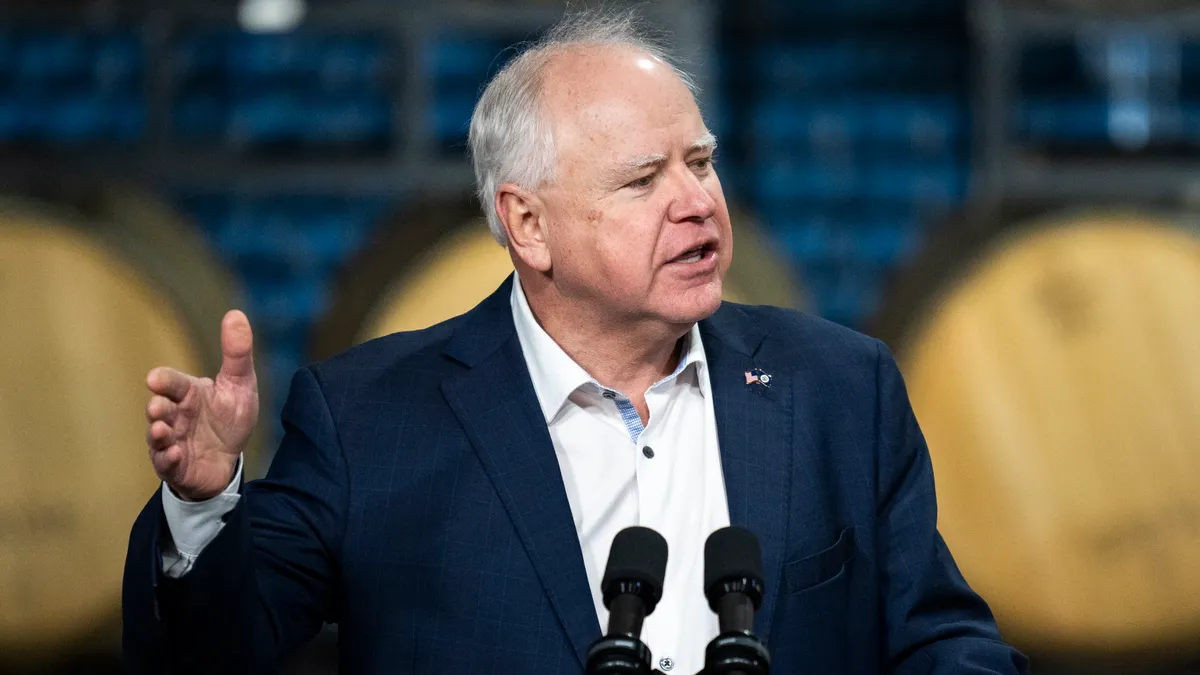 Minnesota Gov. Tim Walz speaks at a podium