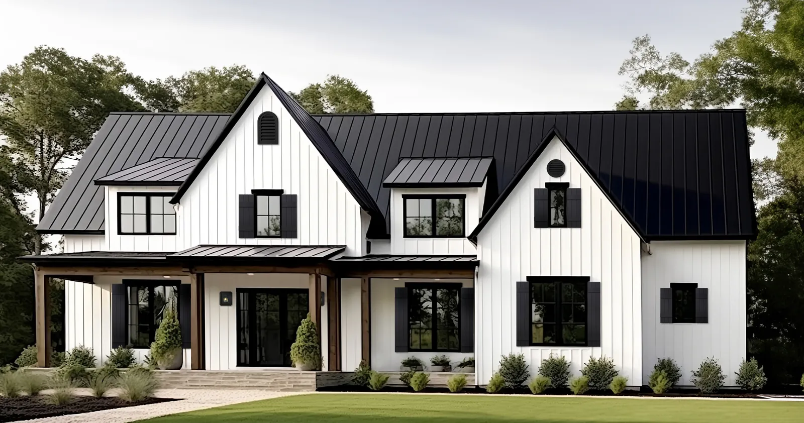 A white house with a black roof and accents.