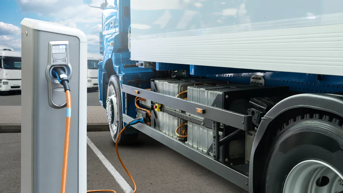 Electric truck batteries are charged from the charging station.