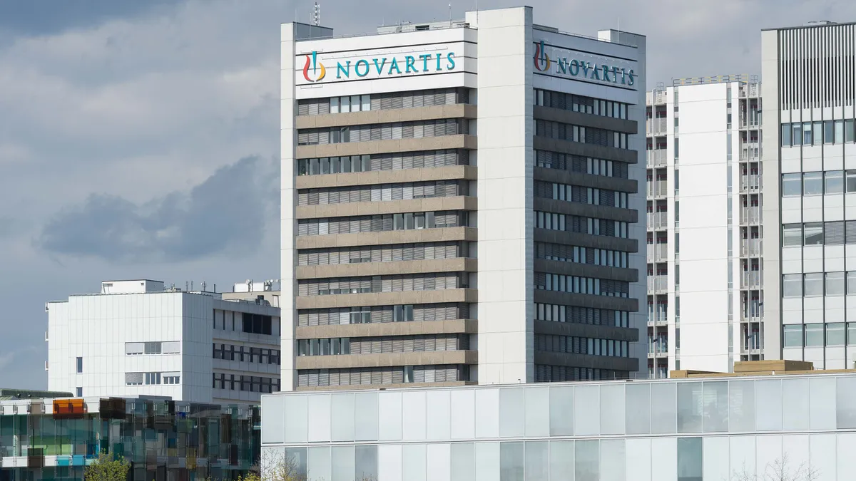 A Novartis logo is seen on the side of an office building.