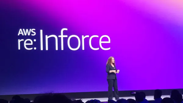 Amy Herzog on stage speaking during a conference