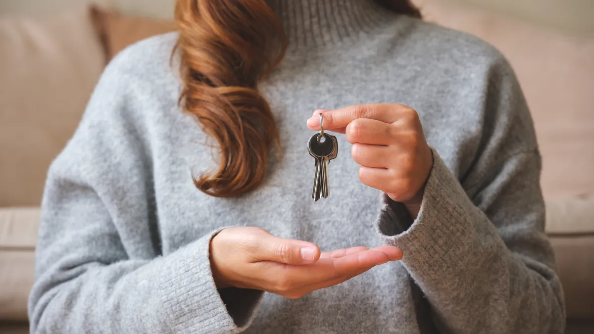 renter holds apartment keys