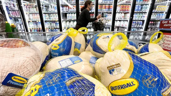 A stack of Butterball turkeys in a grocery store.