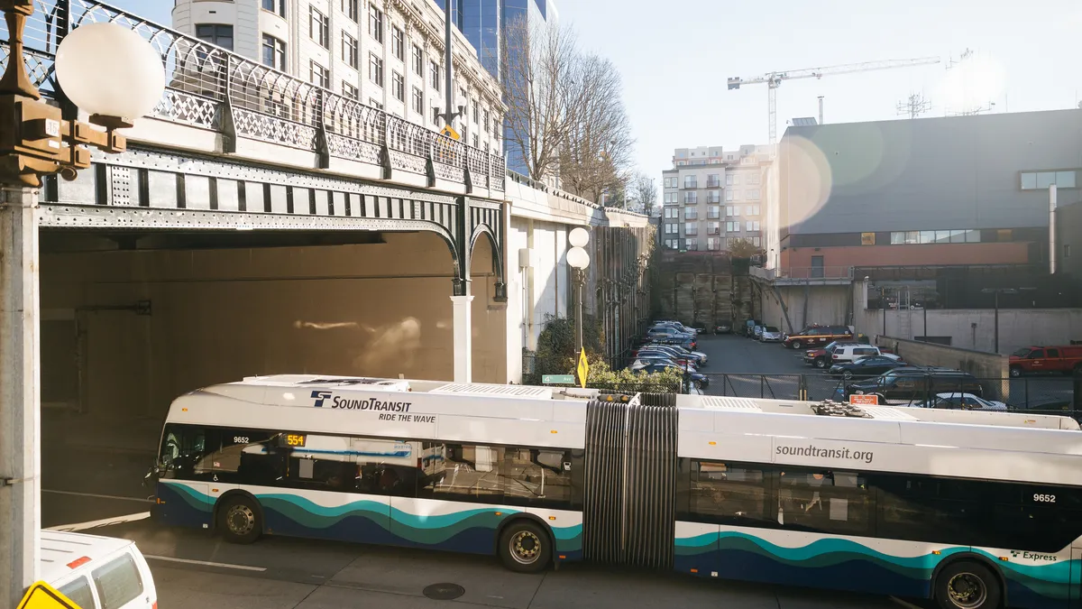 A Sound Transit Express bus moves through downtown Seattle.