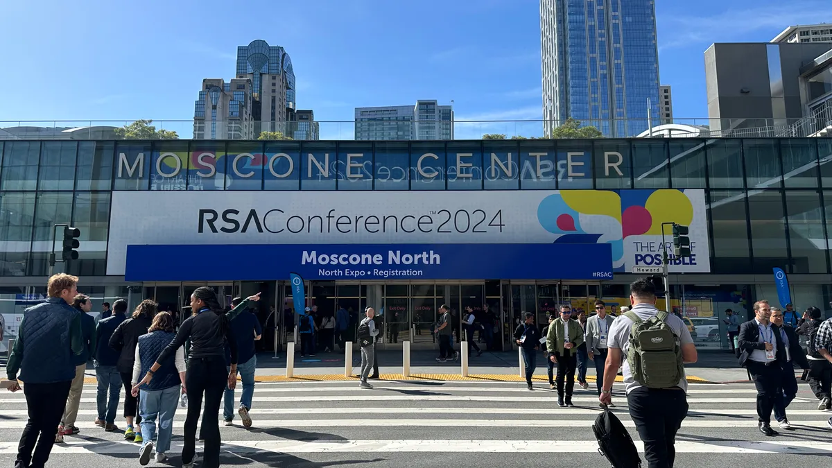 Cybersecurity professionals walk into the RSA Conference at the Moscone Center in San Francisco on May 6, 2024.