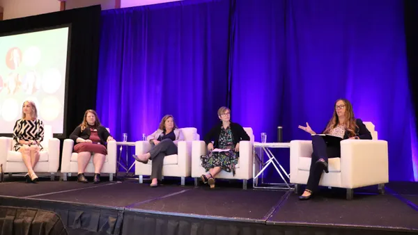 Five speakers sit on stage at the 2025 U.S. Product Stewardship Forum
