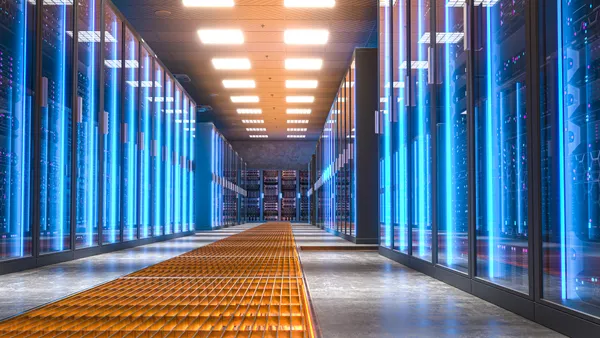 Modern server room with bright blue lights illuminating the corridor and server racks