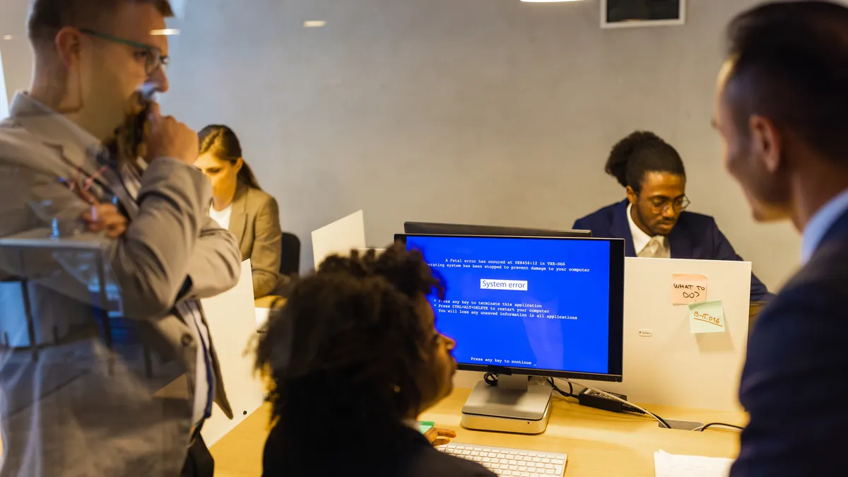 Cybercriminal experts assemble in conference room.