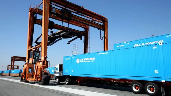 a blue container at an ocean port.