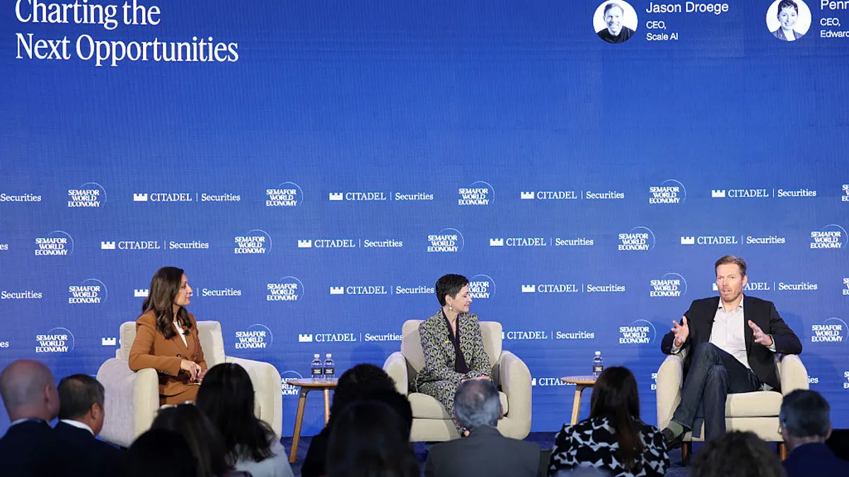 Panelists speak on stage during Semafor World Economy 2026