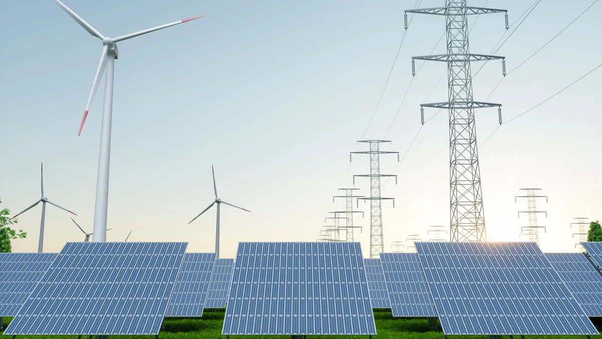 Clean energy wind turbines and solar panels with a high-voltage transmission line.