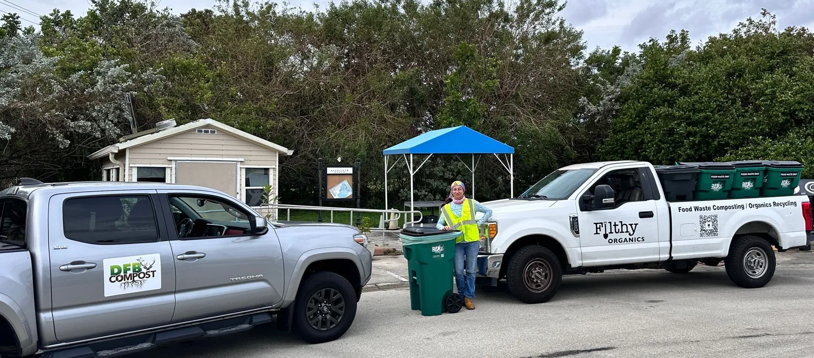 A person stands next to a compost cart in Deerfield Beach, Florida