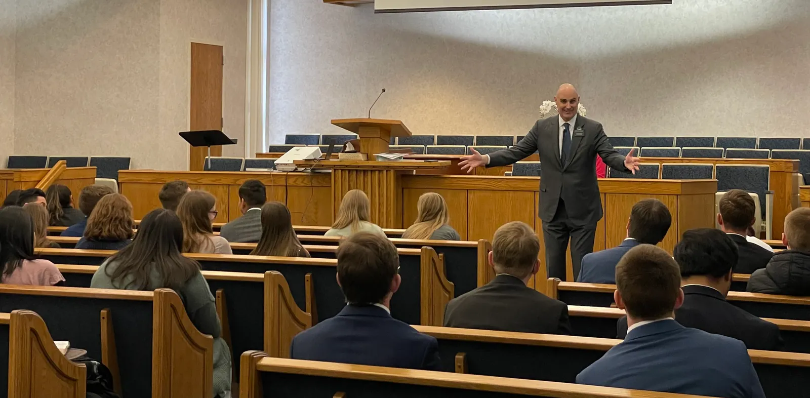 Justin Spencer leading young adults experiencing their first Church of Jesus Christ of Latter-Day Saints mission.