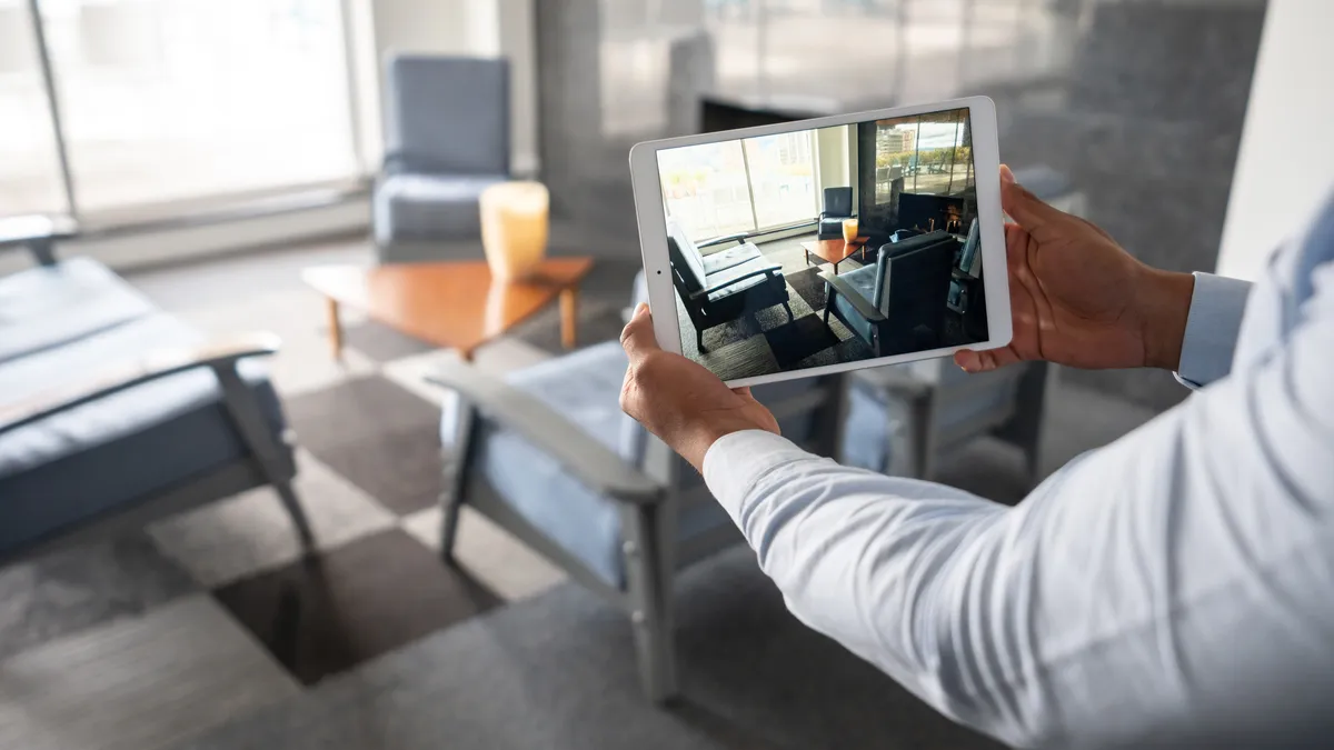 A person showing a property through an online video call using a tablet computer.