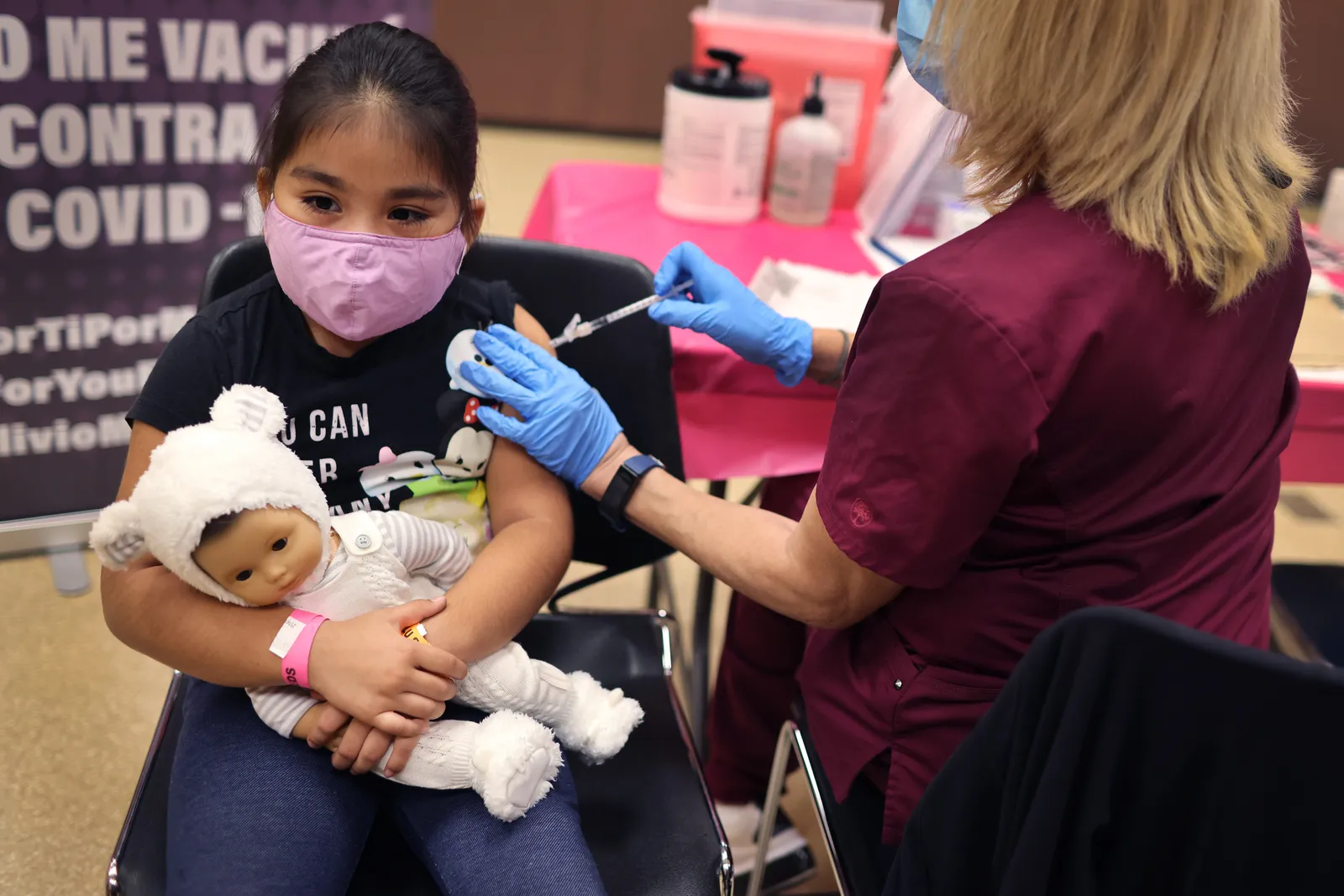 A 1st grade student receives a Covid-19 vaccine at in Chicago, Illinois.