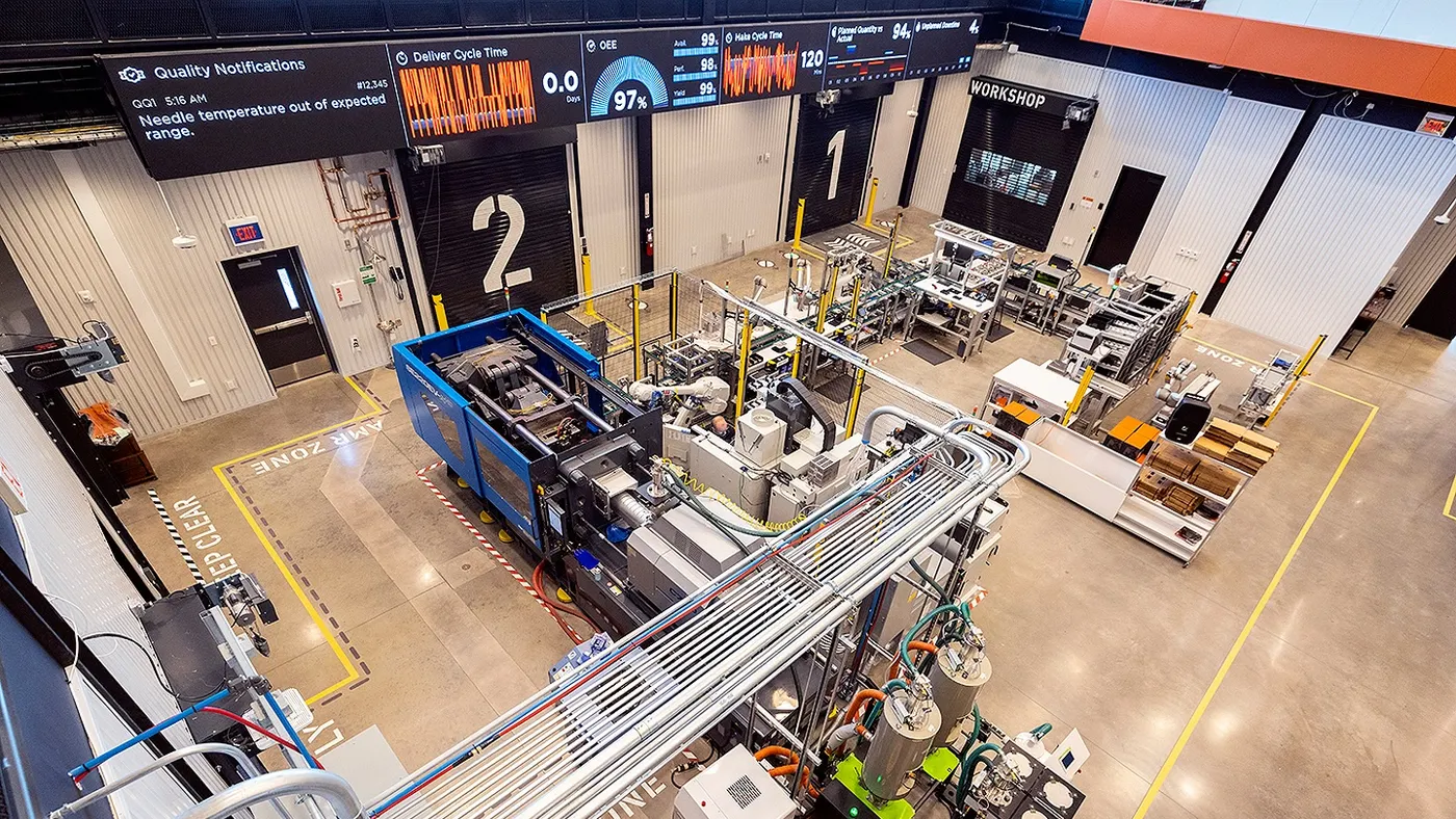 Overhead view of the Deloitte Smart Factory facility, with industrial equipment and display monitors