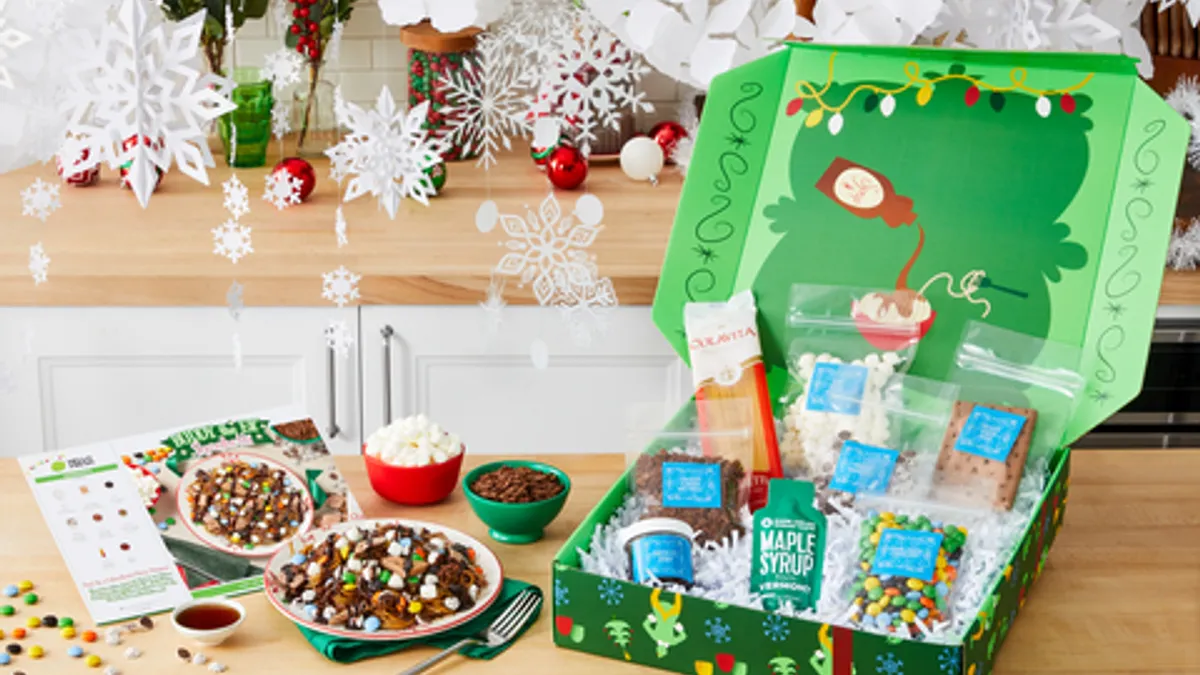 A green meal kit from HelloFresh inspired by the movie "Elf" sits on kitchen counter.