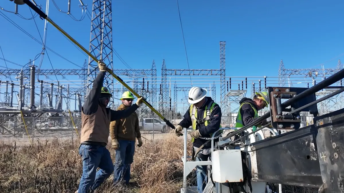Ameren workers install Heimdall Power dynamic line rating technology on congested transmission lines.
