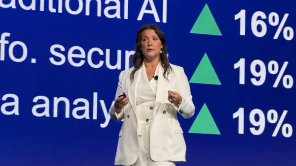 analyst alicia mullery speaking on stage