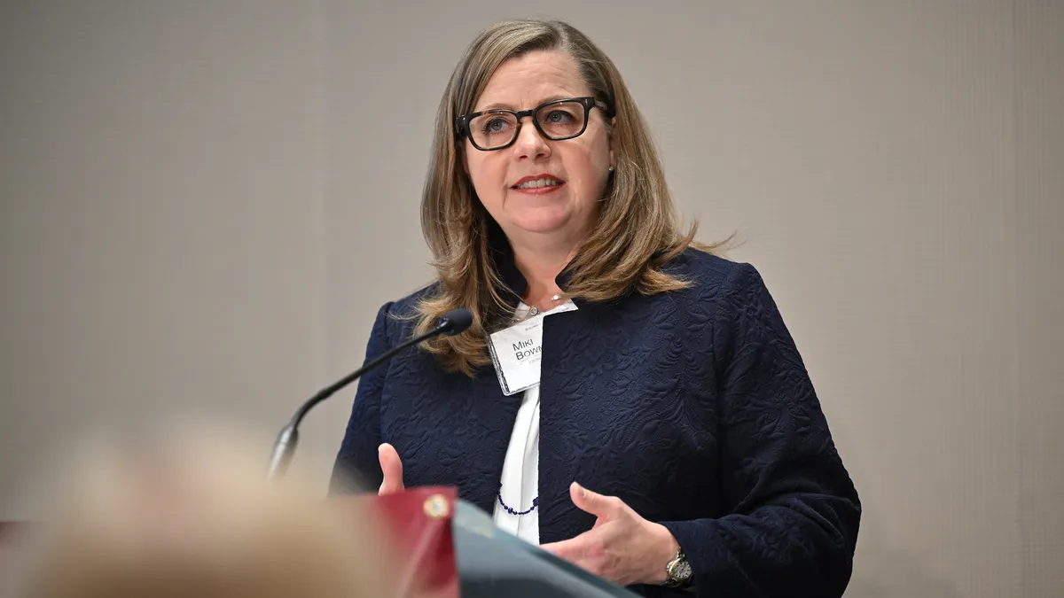 Federal Reserve Governor Michelle Bowman stands behind a podium and speaks.