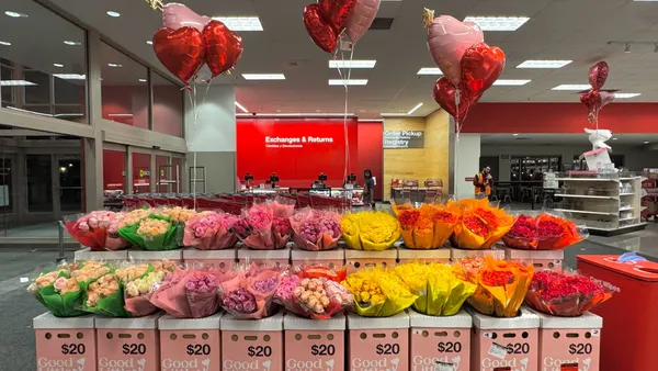 Rows of pink, red and yellow flowers inside a Target store