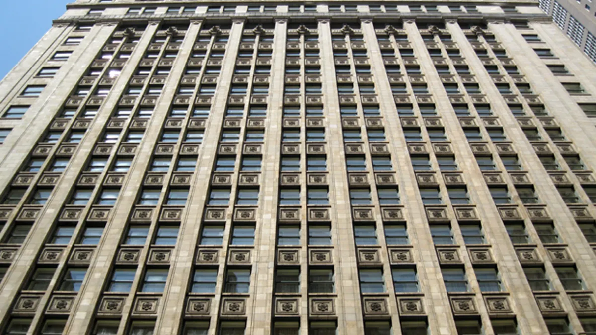 The facade of a terracotta building.