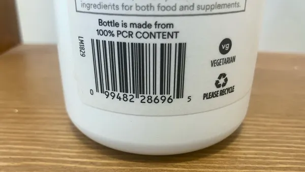 The bottom half of a supplements bottle features a barcode and states 'Bottle is made from 100% PCR CONTENT'